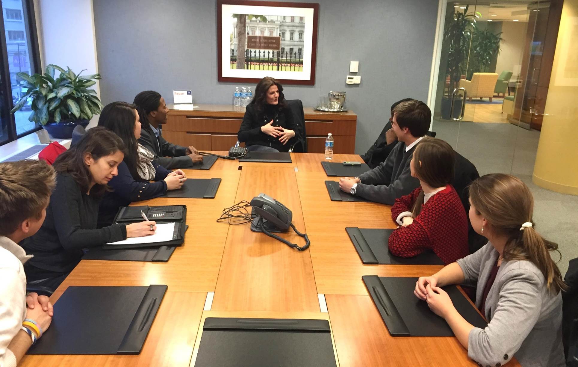A group of people sitting at a table

Description automatically generated with low confidence